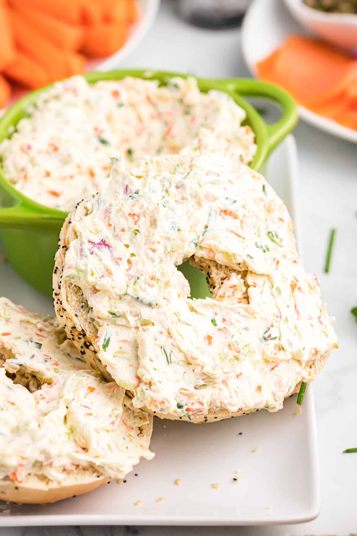 bagels topped with vegetable cream cheese.