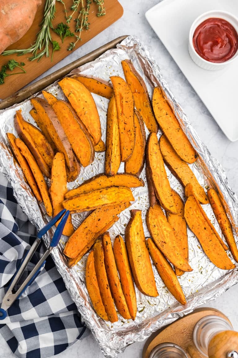 roasted sweet potato wedges on a sheet pan.