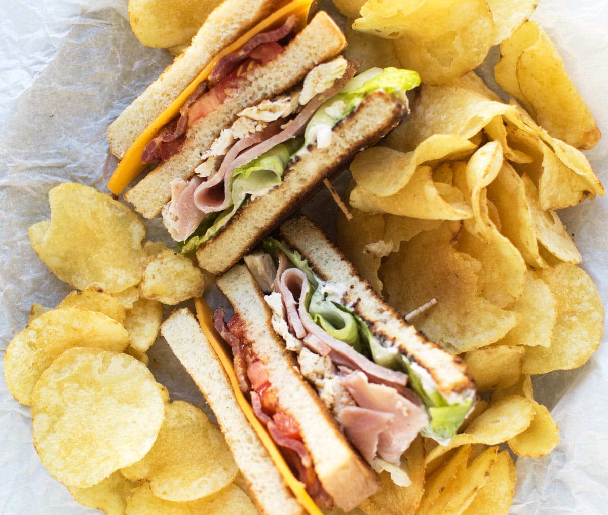 club sandwiches with salt and vinegar chips.