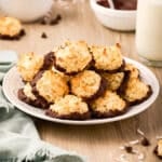 a plate of chocolate dipped macaroons.