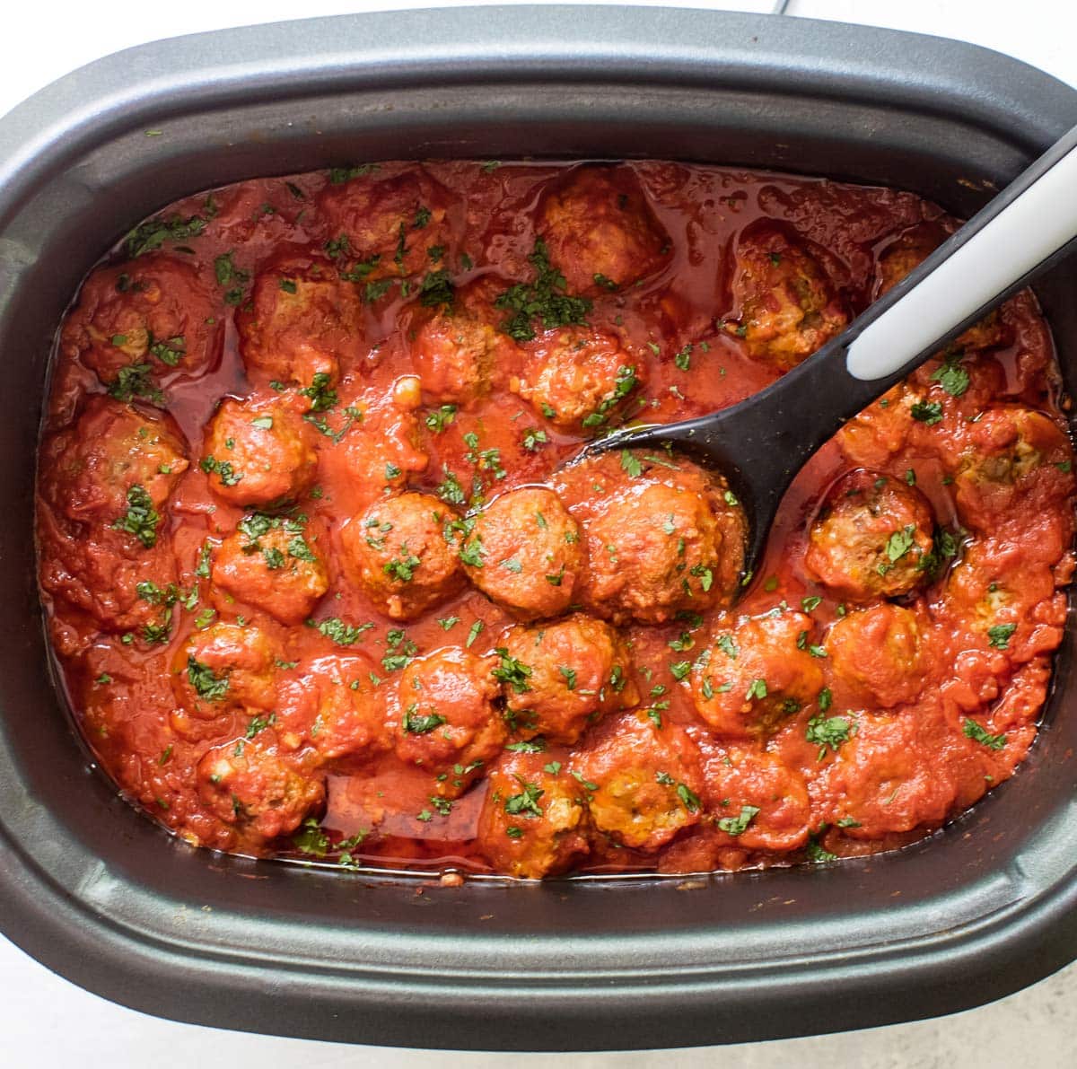 meatballs and sauce in a slow cooker.