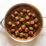 meatballs and sauce in a skillet.