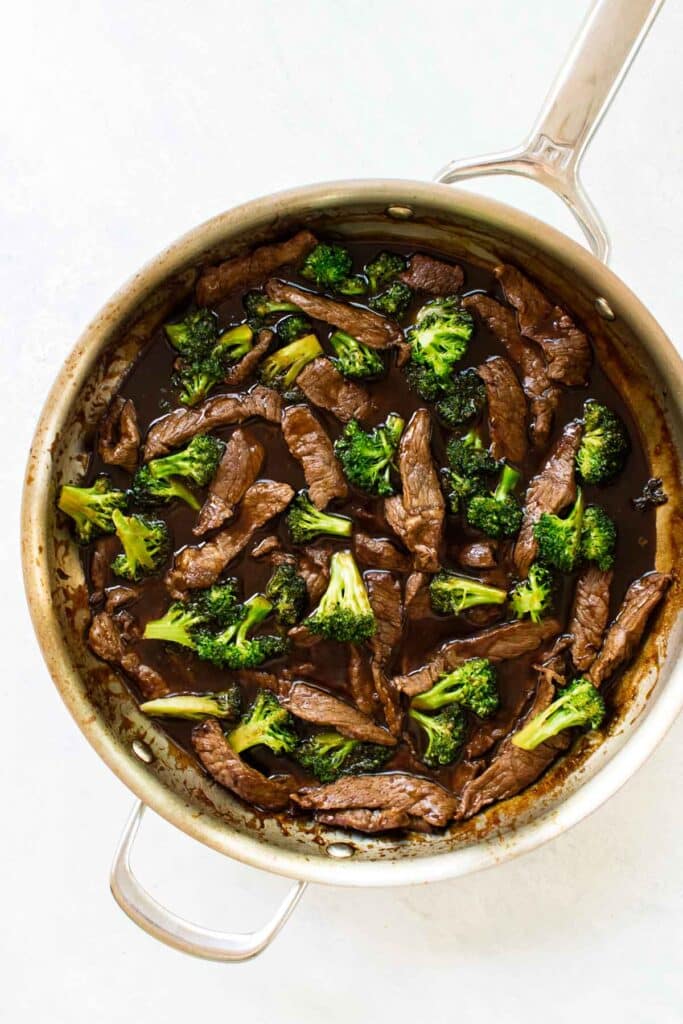 beef and broccoli in a skillet.