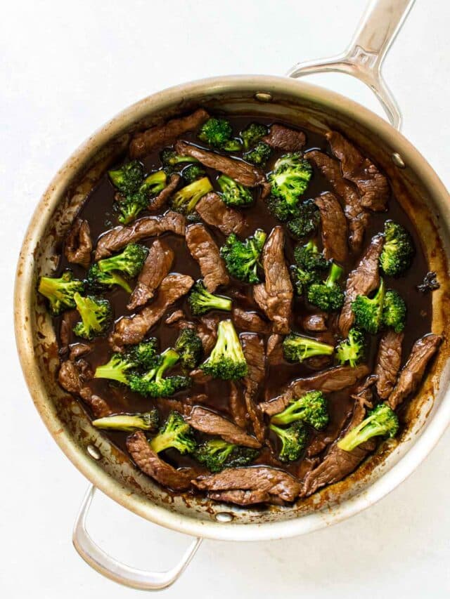 beef and broccoli in a skillet.