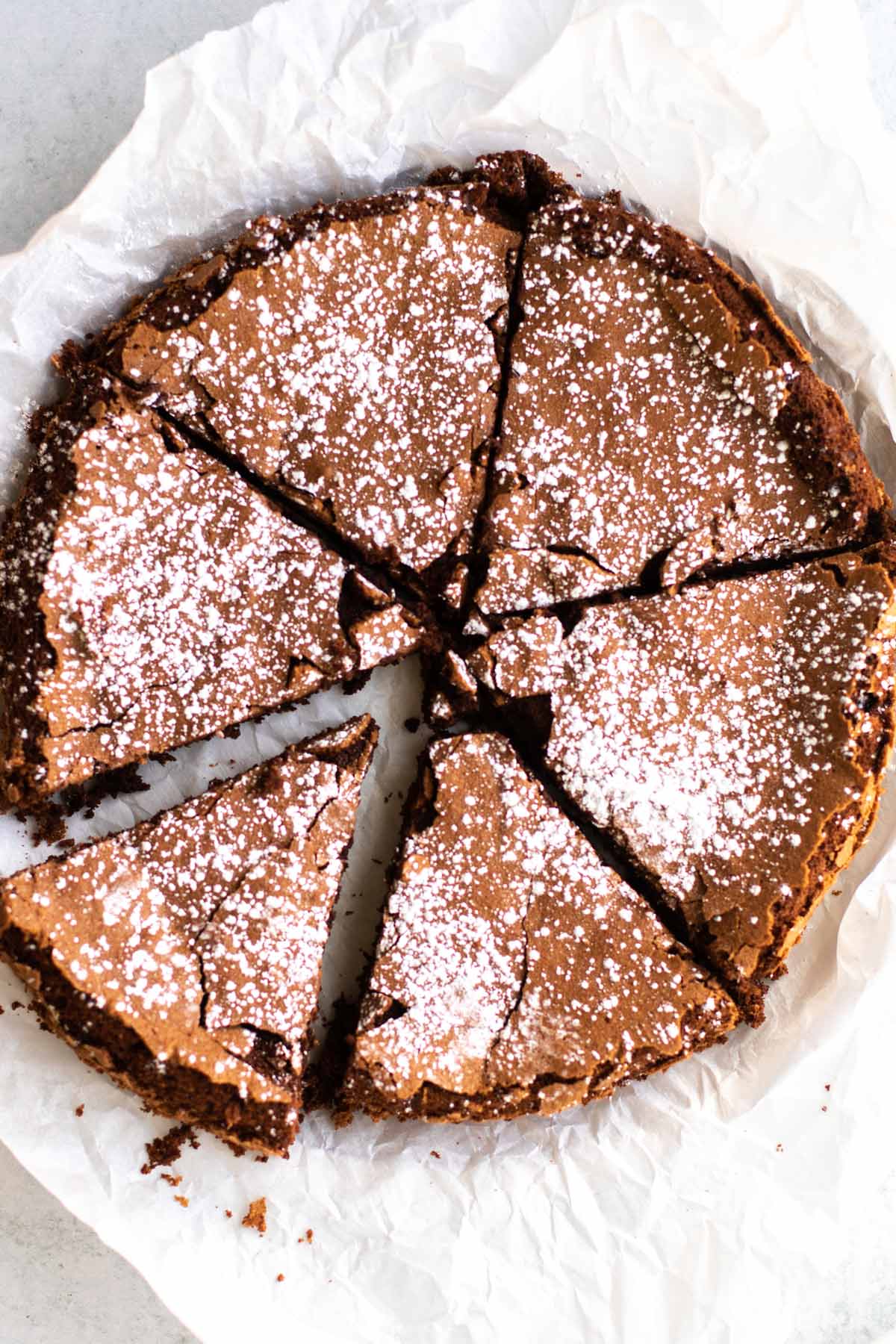 flourless chocolate cake dusted with powdered sugar.