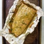 honey mustard salmon in foil on a sheet pan.