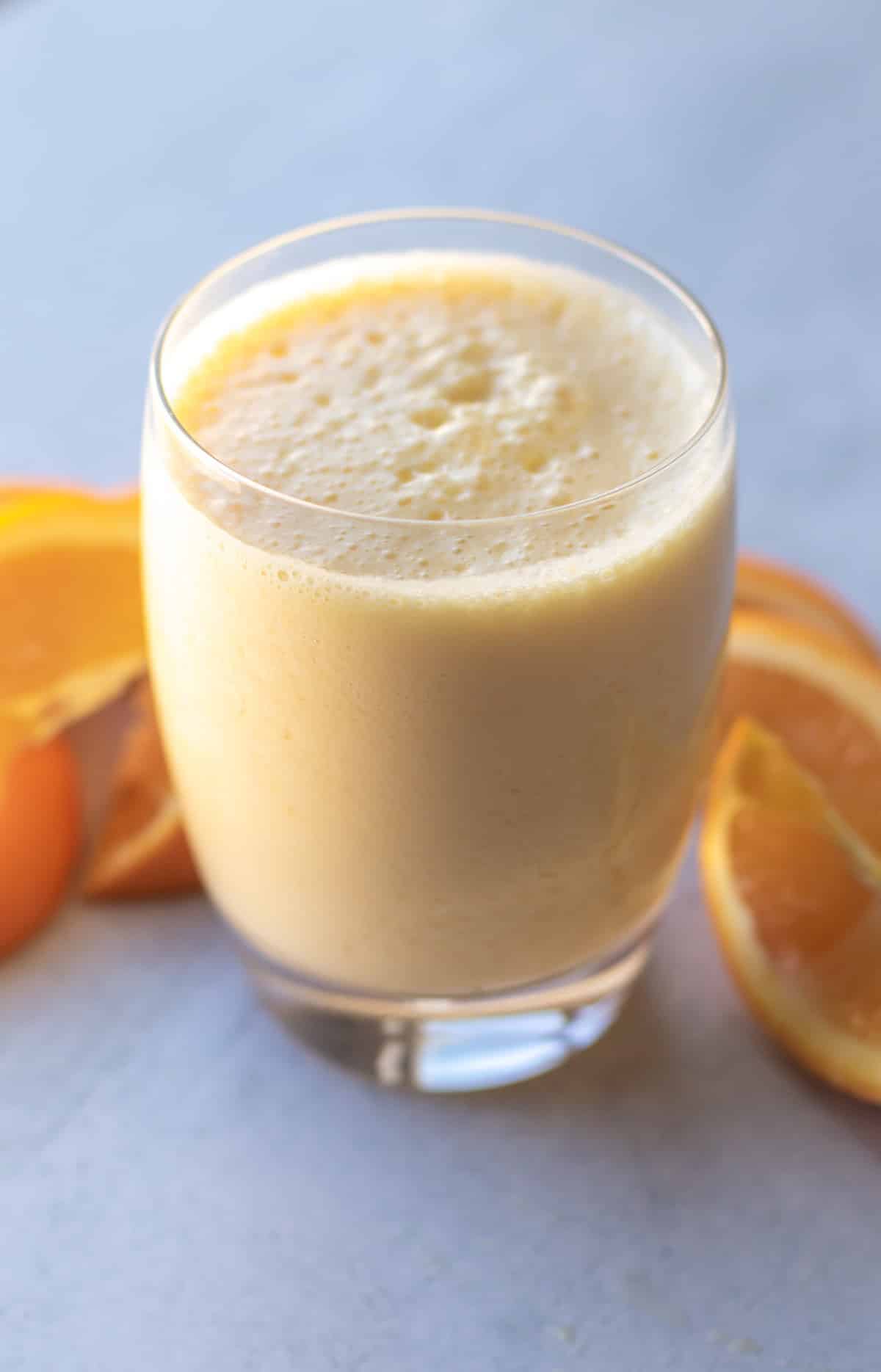 a glass of orange smoothie.