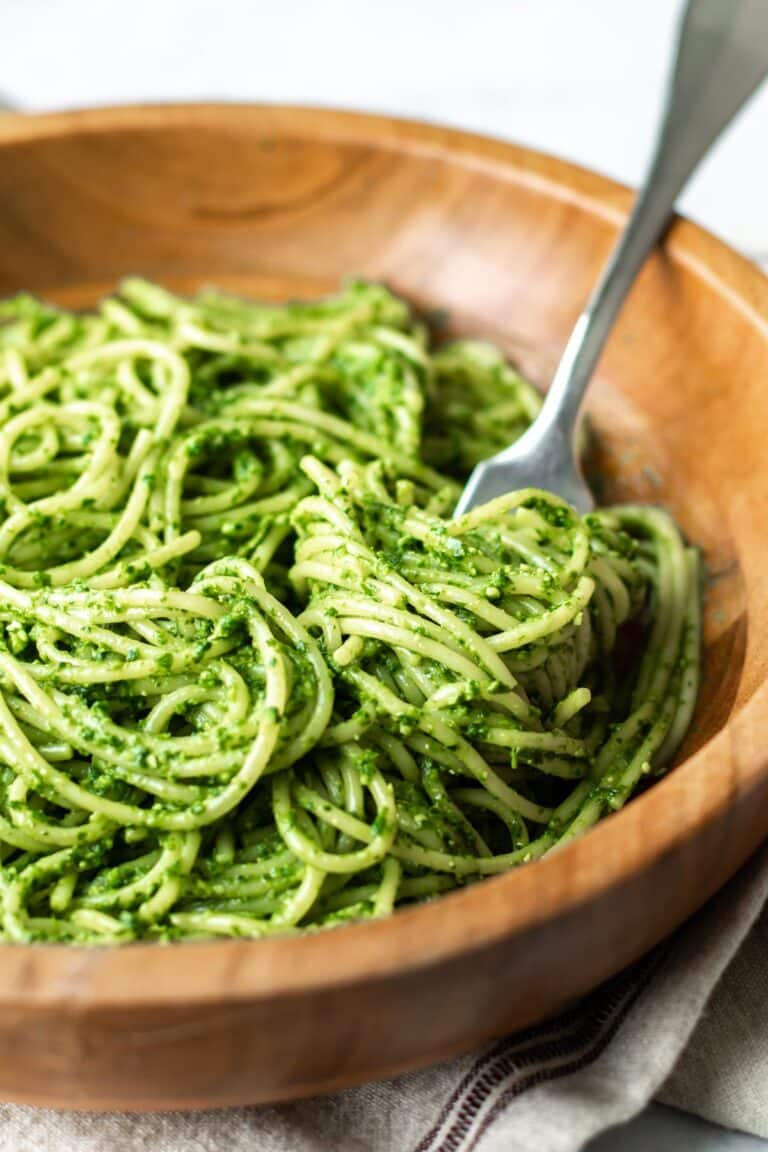 a bowl of parsley pesto spaghetti.