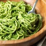 pesto pasta in a bowl with a fork.