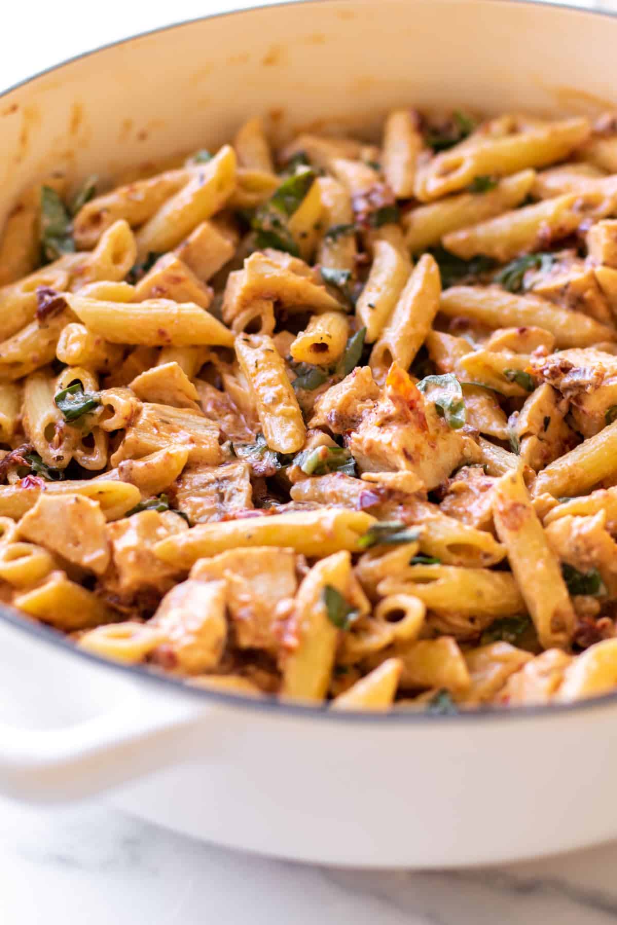 tuscan chicken penne in a pan.