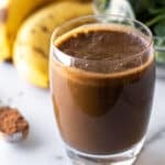 a green coffee chocolate smoothie in a glass.