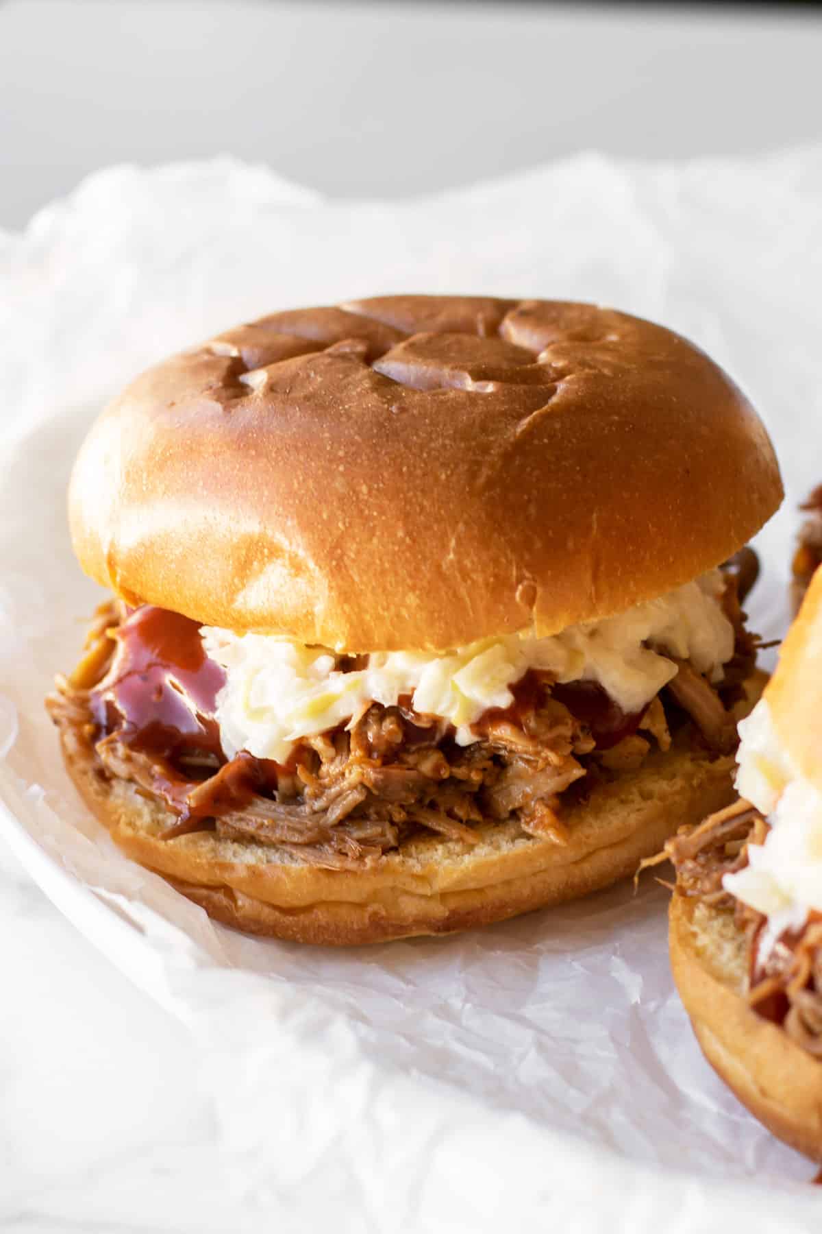 https://www.girlgonegourmet.com/wp-content/uploads/2023/05/Pulled-Pork-Sandwiches-2.jpg