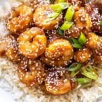 teriyaki shrimp on a bed of rice.