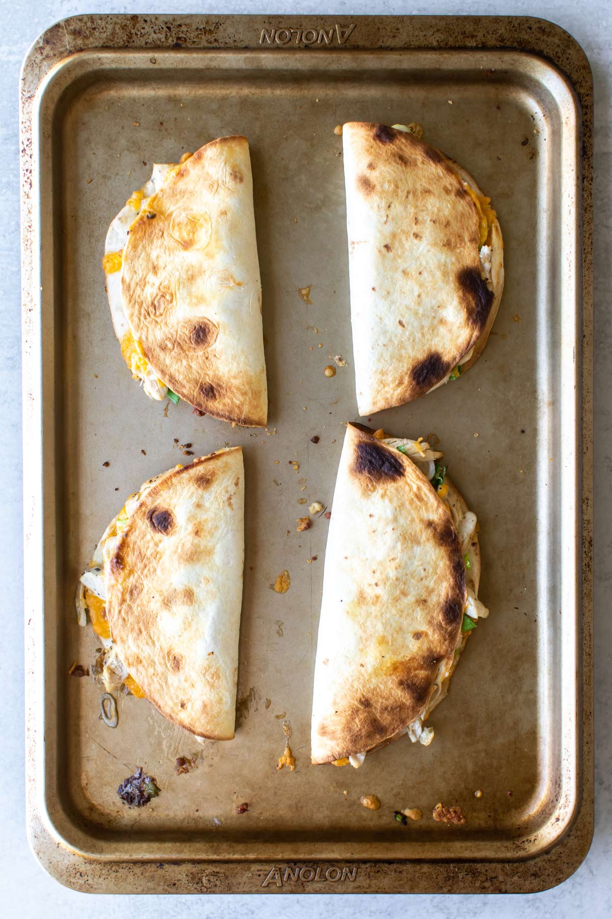 crispy quesadillas on a sheet pan.