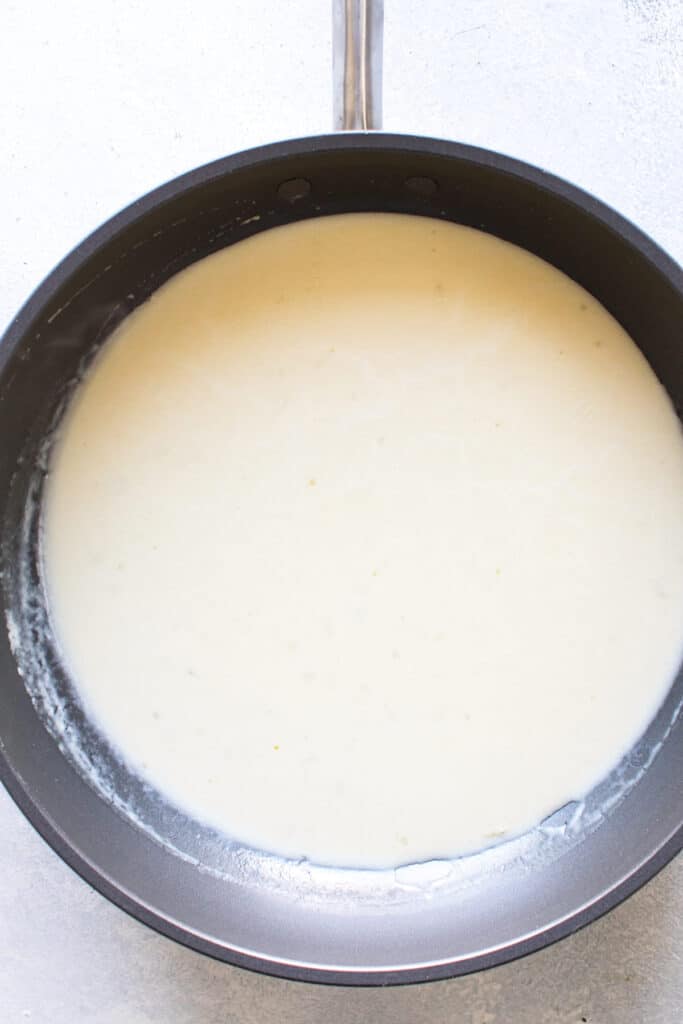 white sauce in a pan.