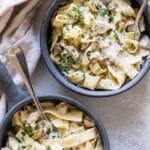 two bowls of chicken and noodles.