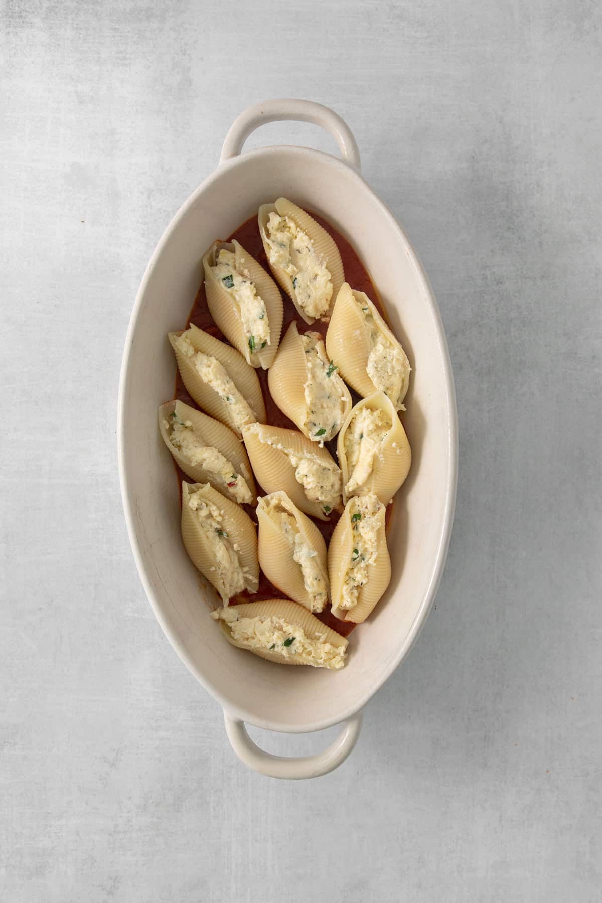 the stuffed shells placed in a baking dish.