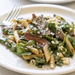 a plate of steak pasta.