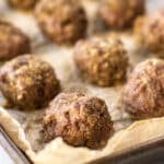 baked meatballs on a sheet pan.