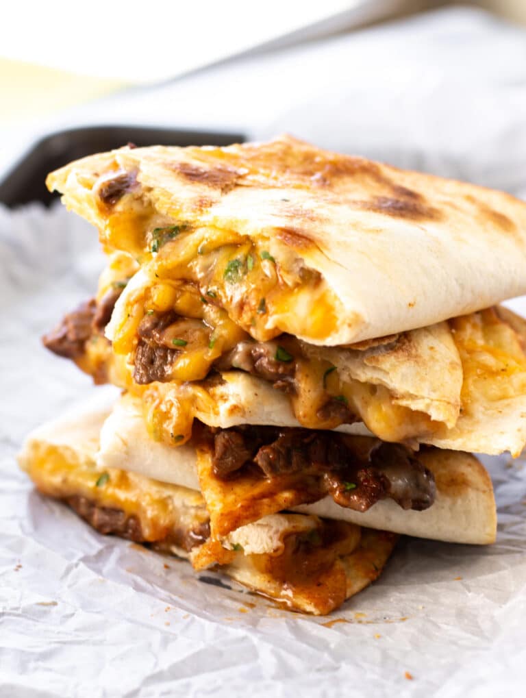 a stack of steak quesadillas.