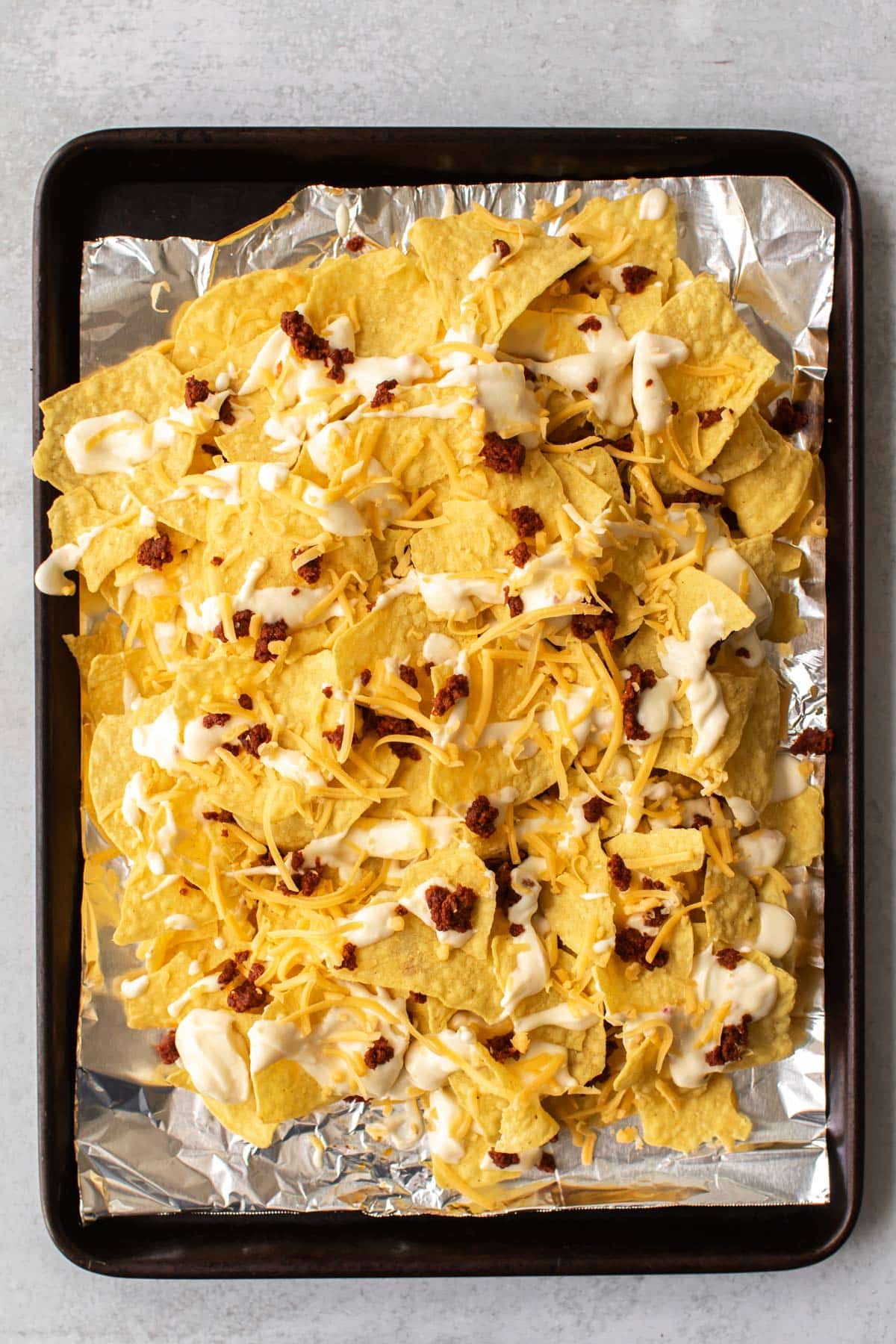 the nachos ready to go in the oven.