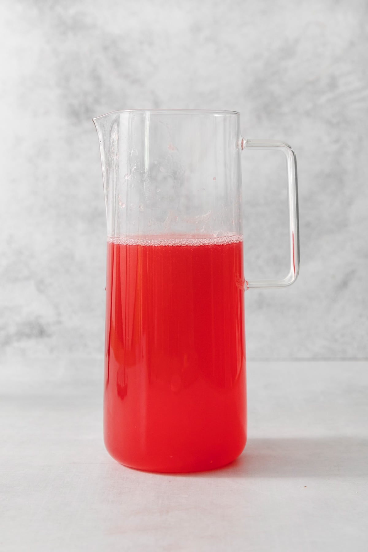 a pitcher of cranberry lemonade.