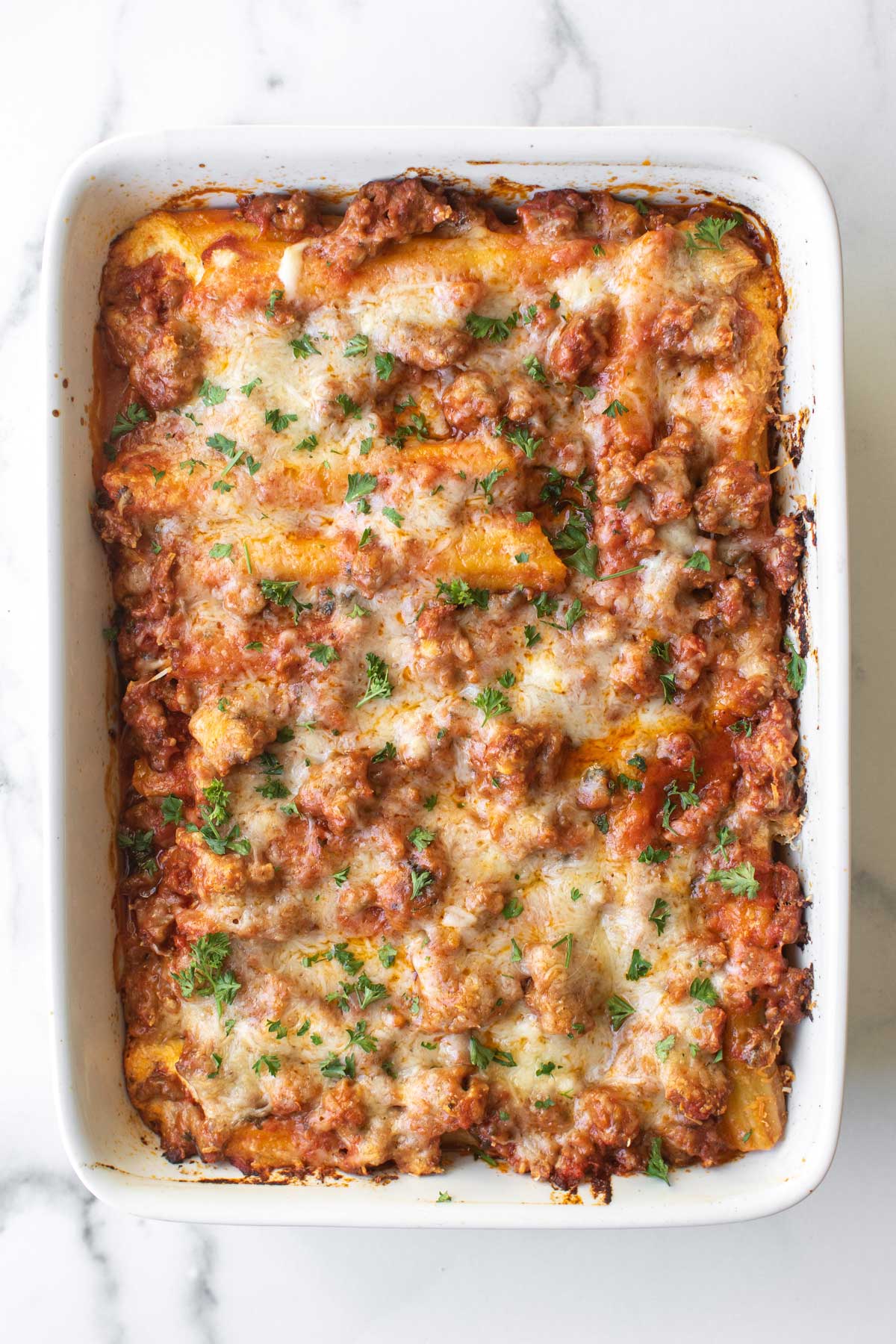 the baked cheese manicotti in a pan.