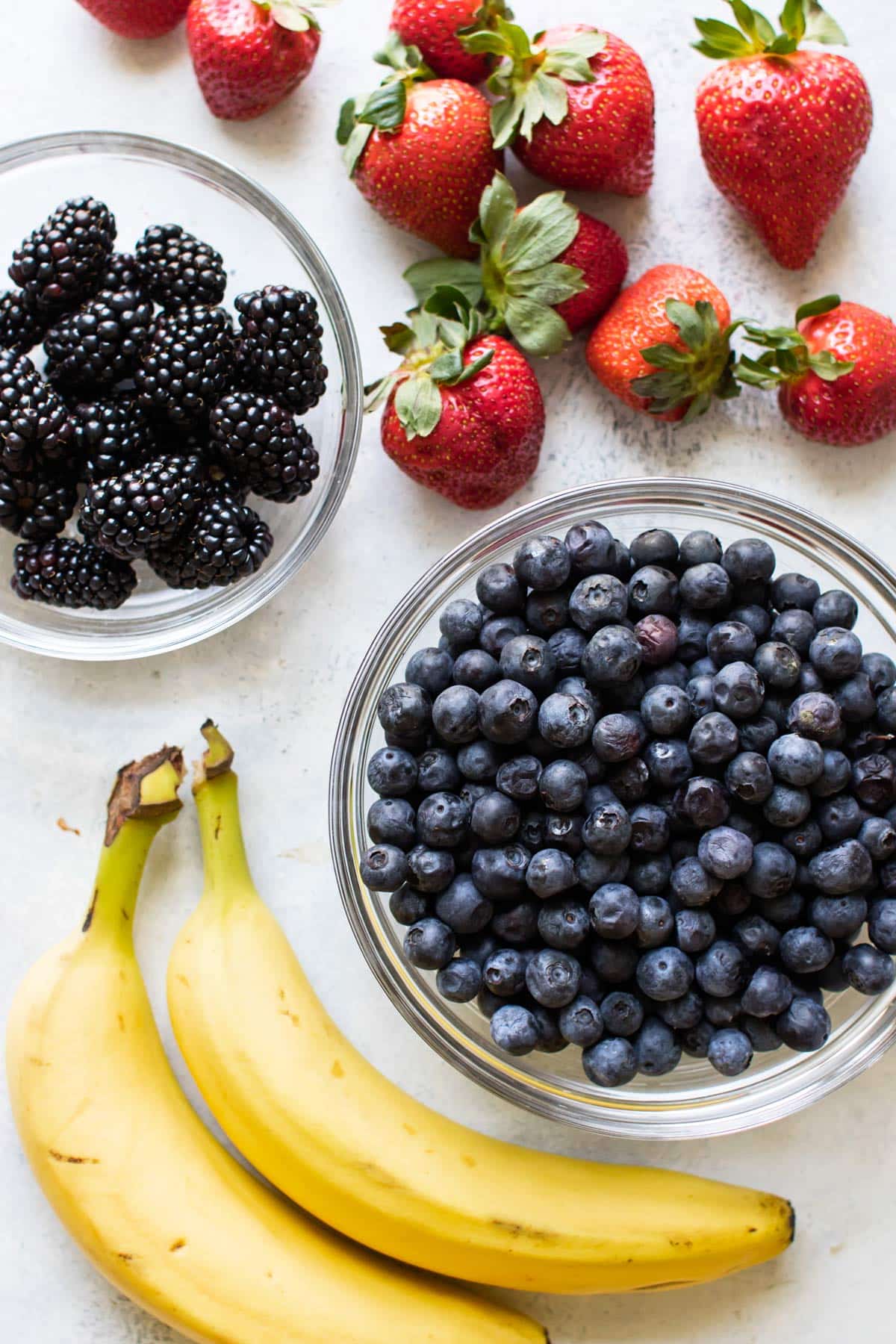 blackberries, strawberries, blueberries, and bananas.