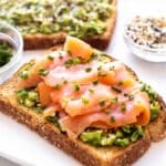 avocado toast topped with smoked salmon.