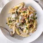 blue cheese steak pasta in a bowl with a fork.