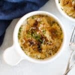 a bowl of ravioli with parmesan cream sauce.