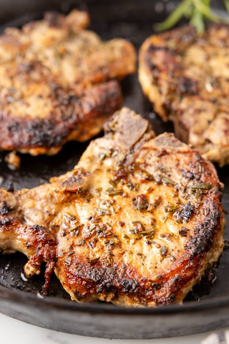 cooked pork chops in a pan.