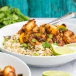 shrimp and peppers in a bowl with rice.