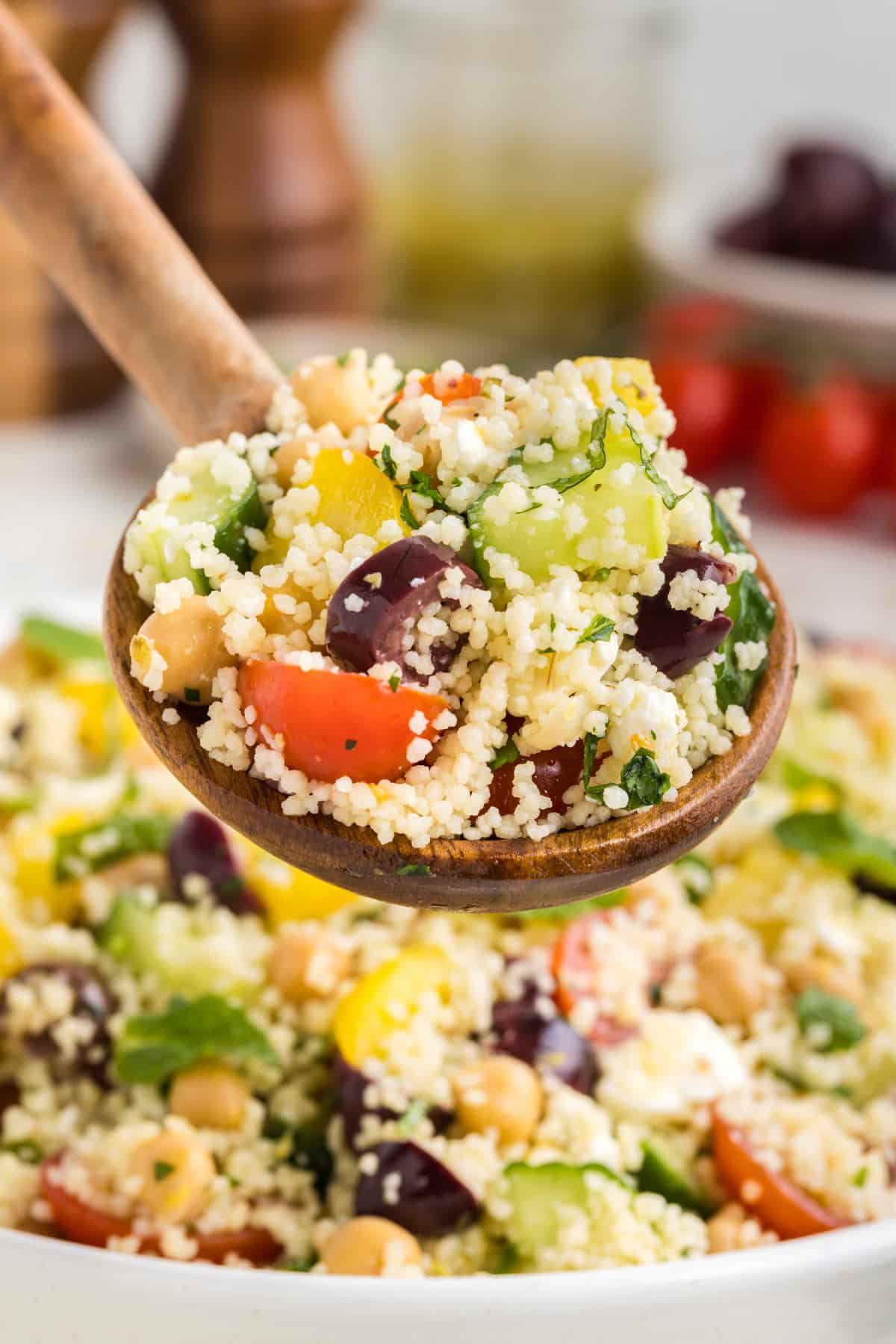 a scoop of Mediterranean couscous salad.