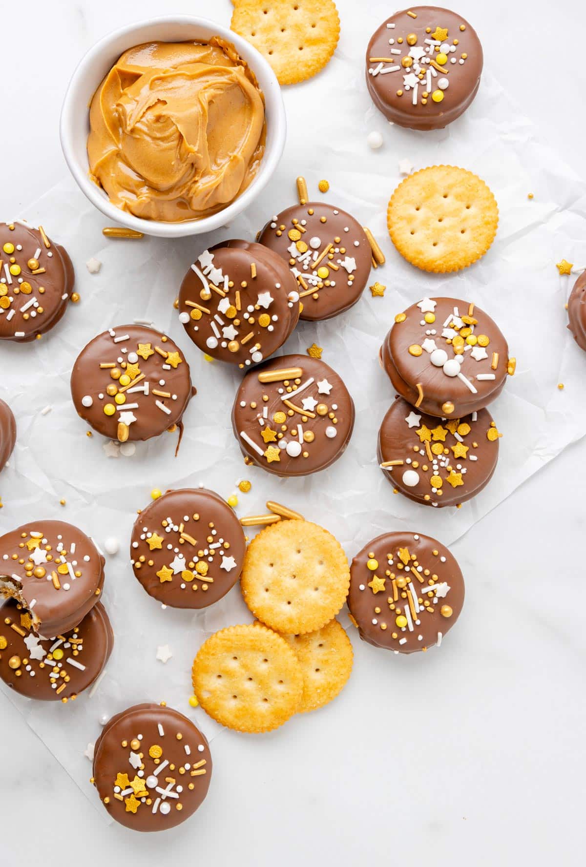 ritz cookies, a bowl of peanut butter, and ritz crackers.