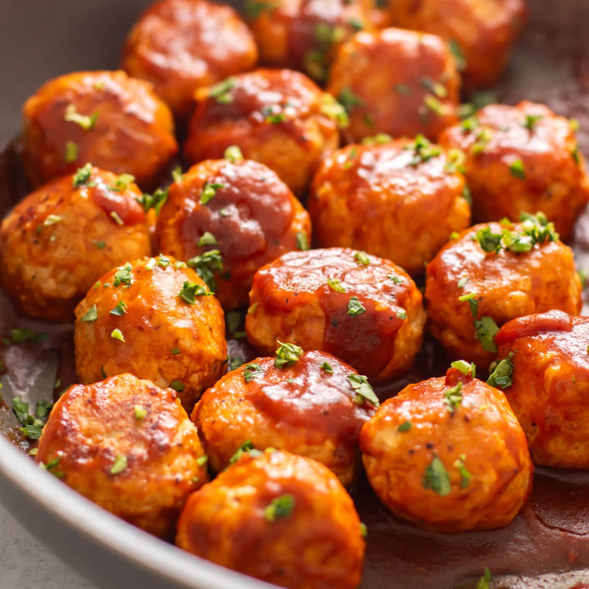 BBQ chicken meatballs garnished with parsley.