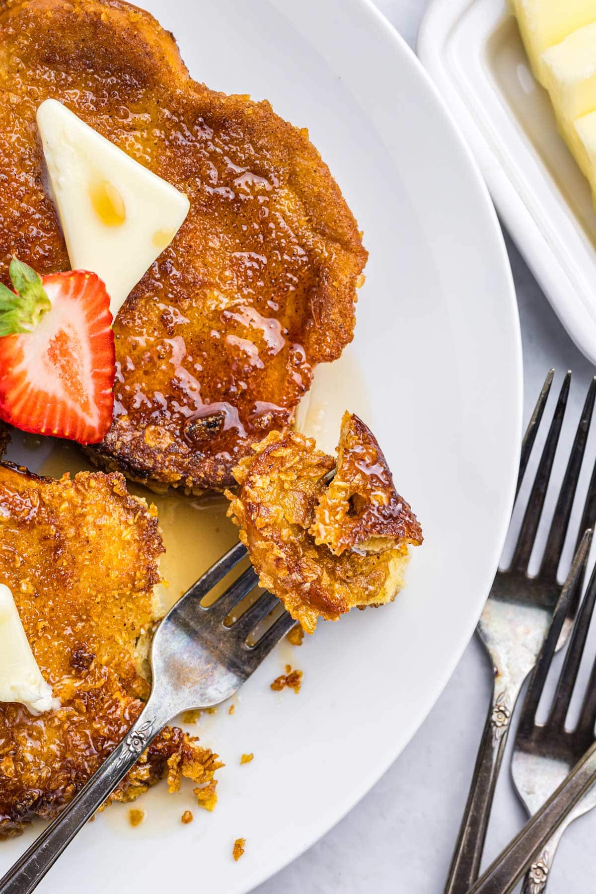 a plate of french toast with a fork.