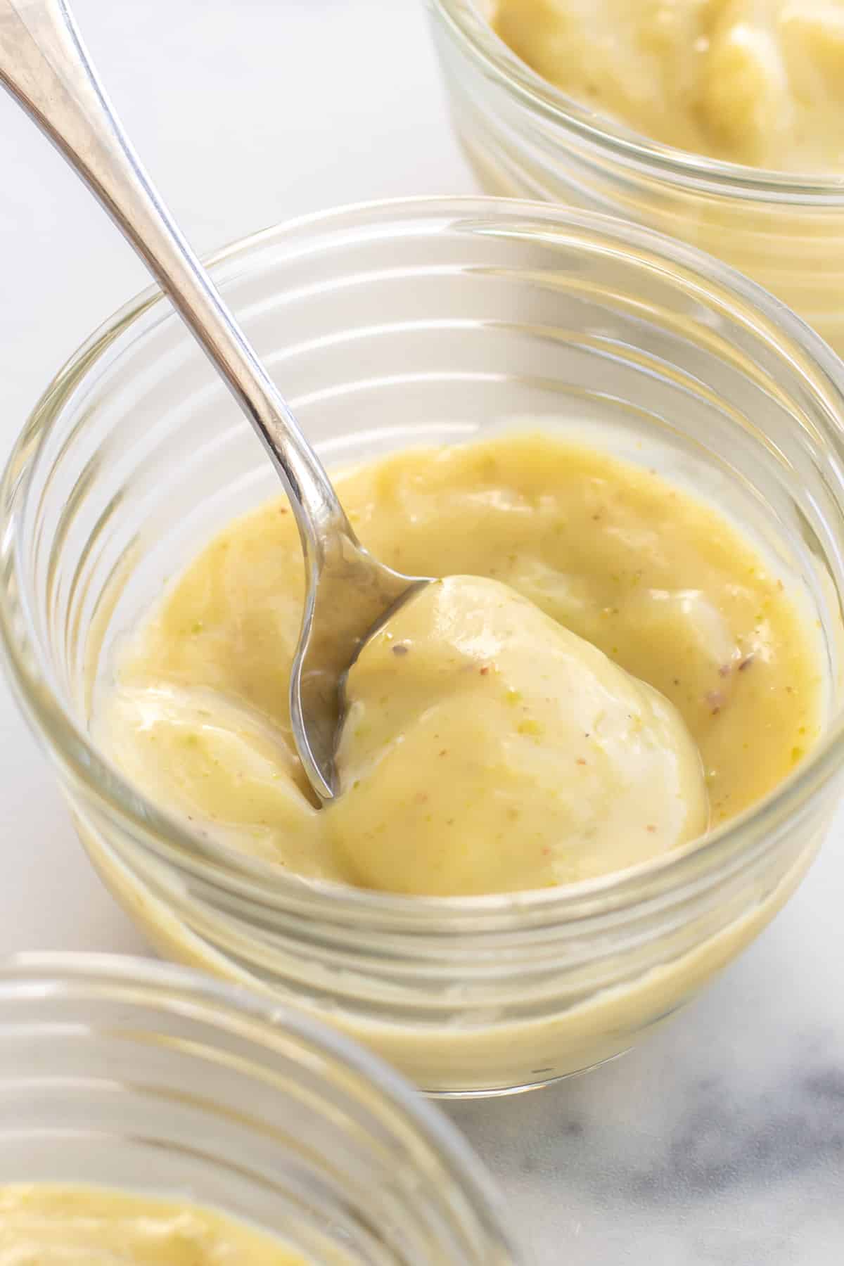 a bowl of pistachio pudding with a spoon.