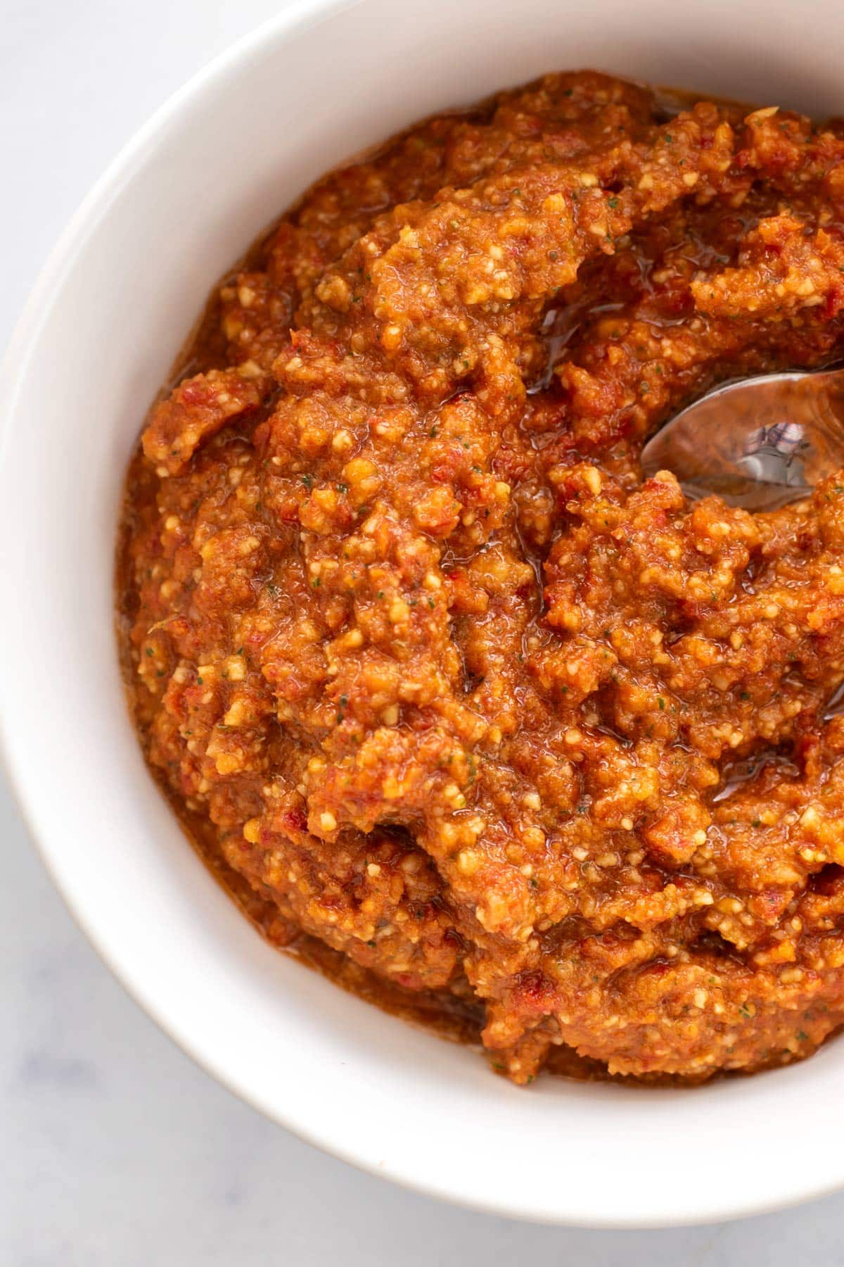 a bowl of red pesto.
