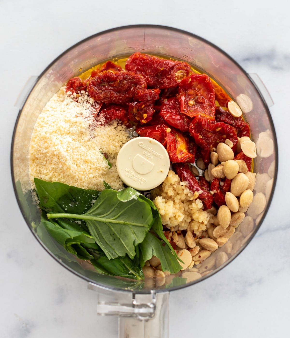 ingredients for the pesto in a food processor.