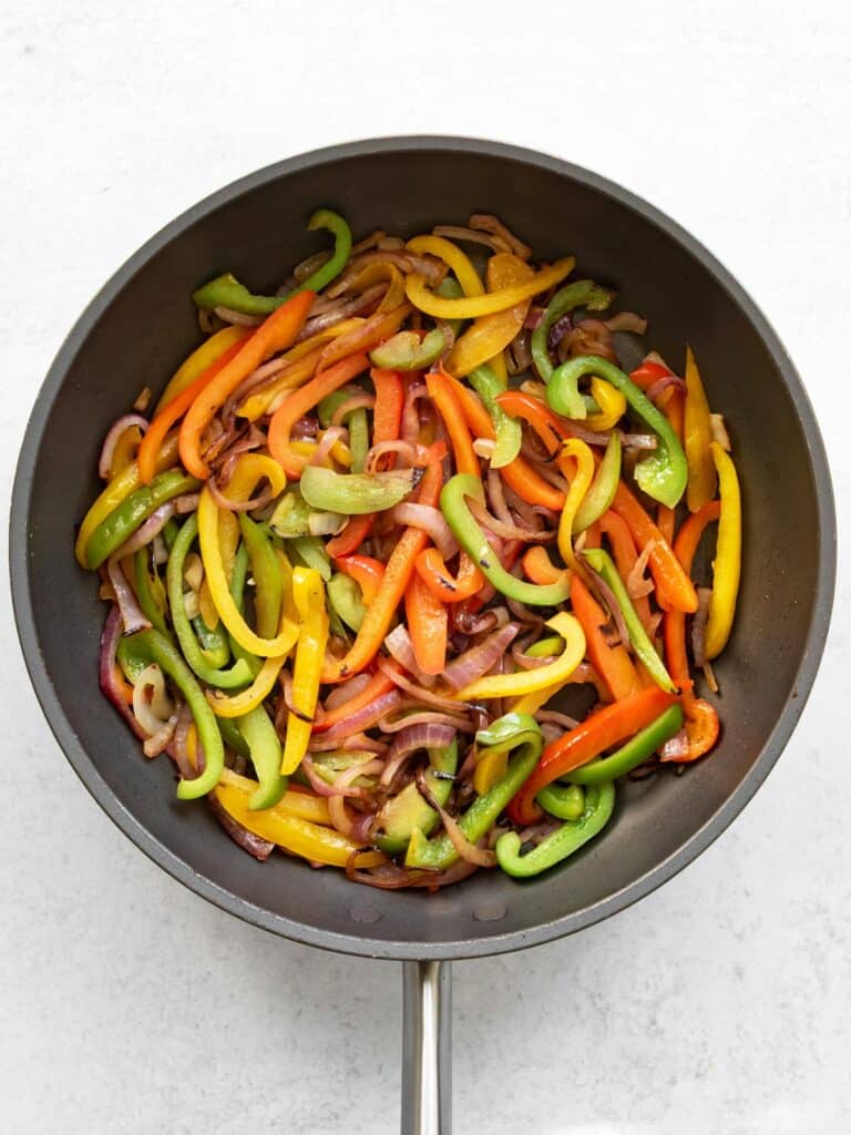 the cooked peppers and onions.