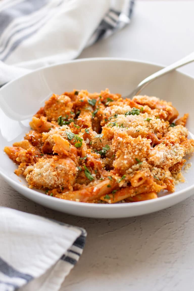 chicken parm pasta in a white bowl.