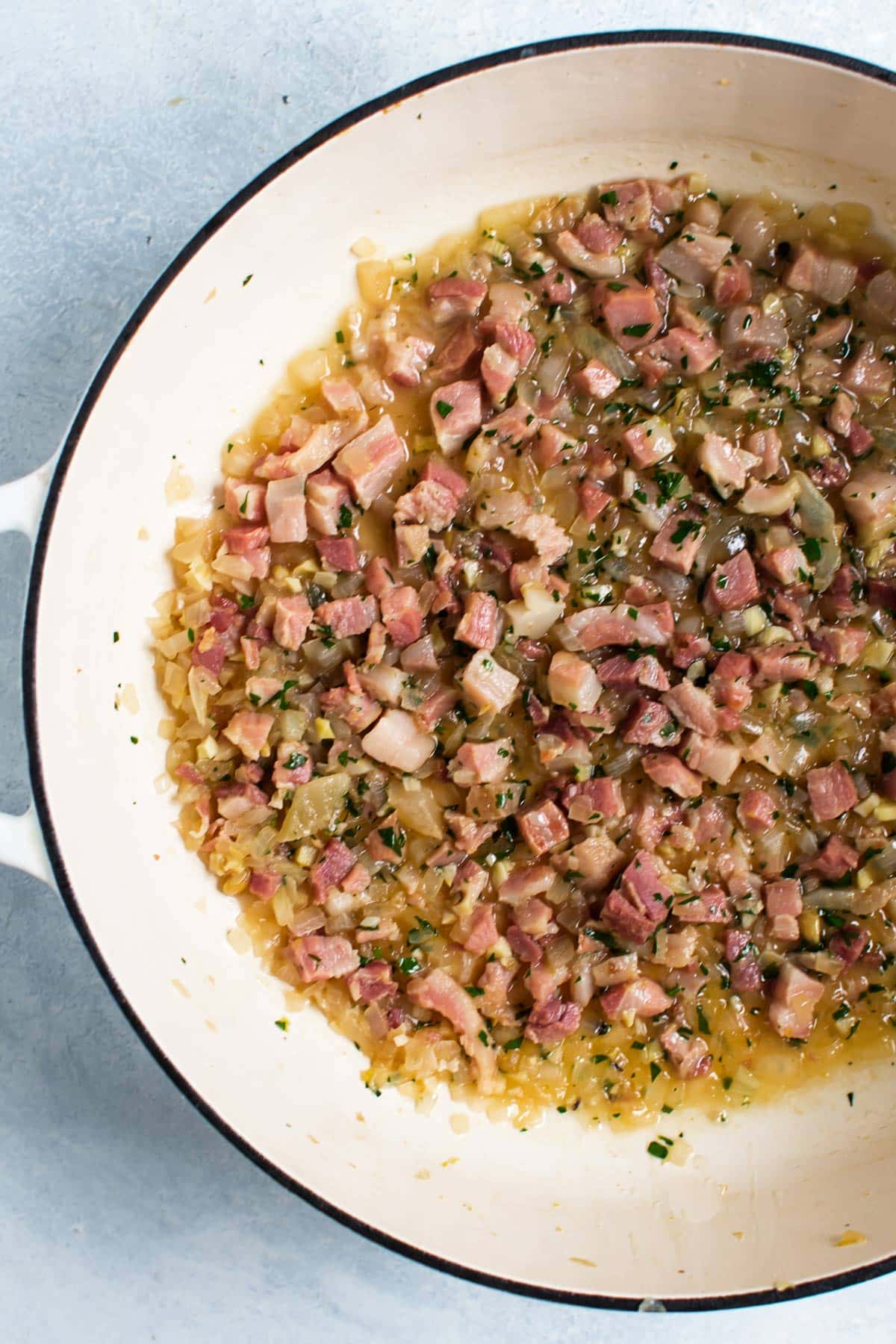 pancetta cooking in a pan.