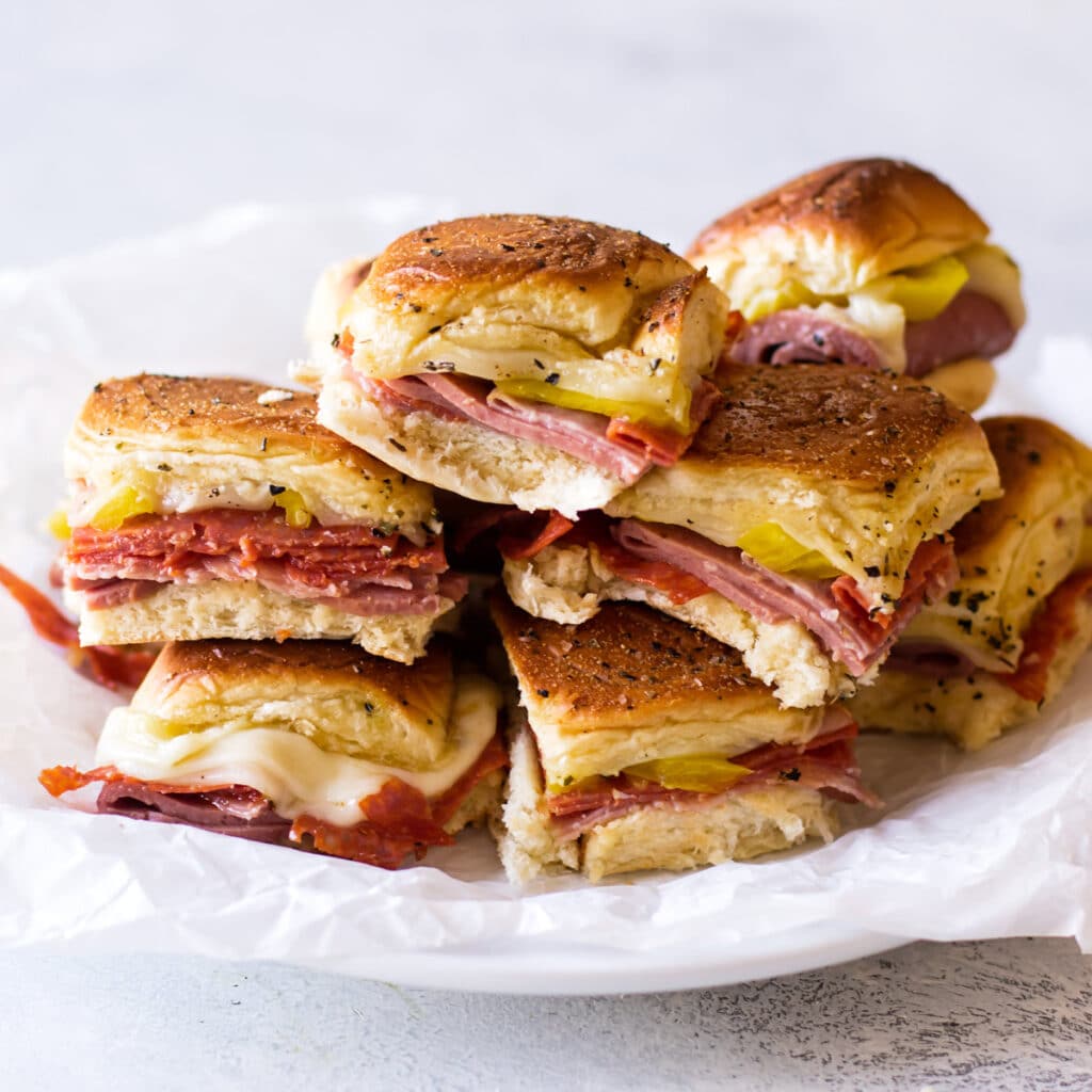 a plate of italian sandwiches.