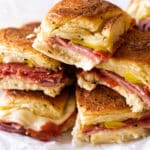 a plate of sandwiches stacked on each other.