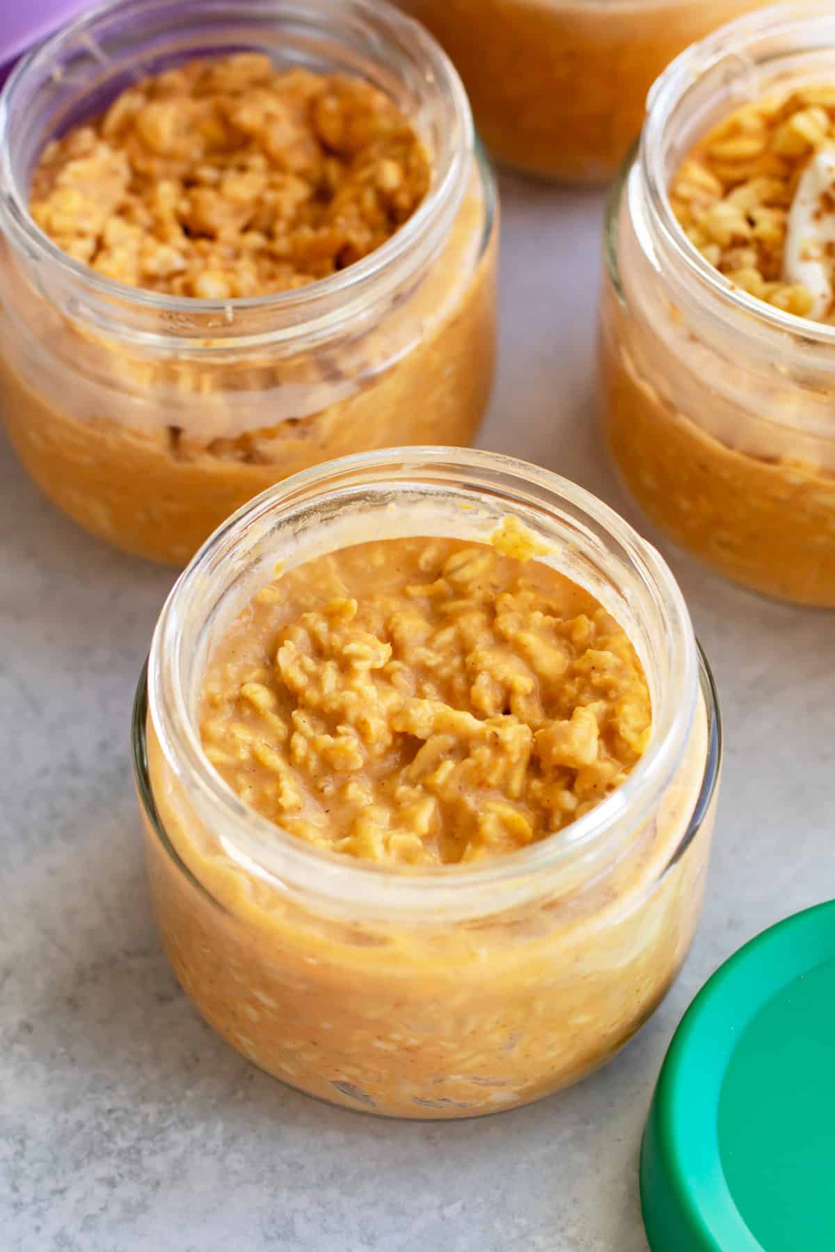 a container of pumpkin oats after it's chilled in the refrigerator.