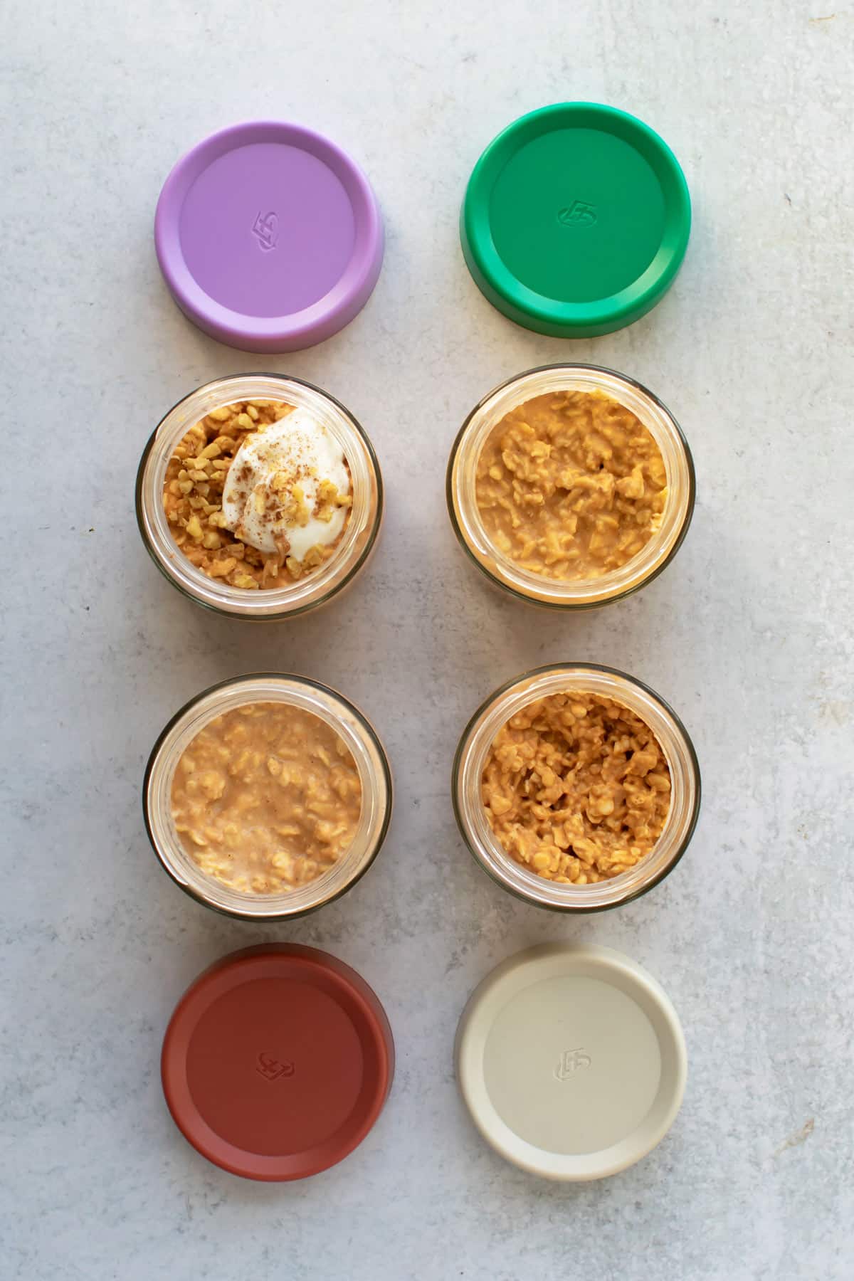 the finished oats. A plain one, one with milk, one warmed up, and one with a spoonful of yogurt on top.