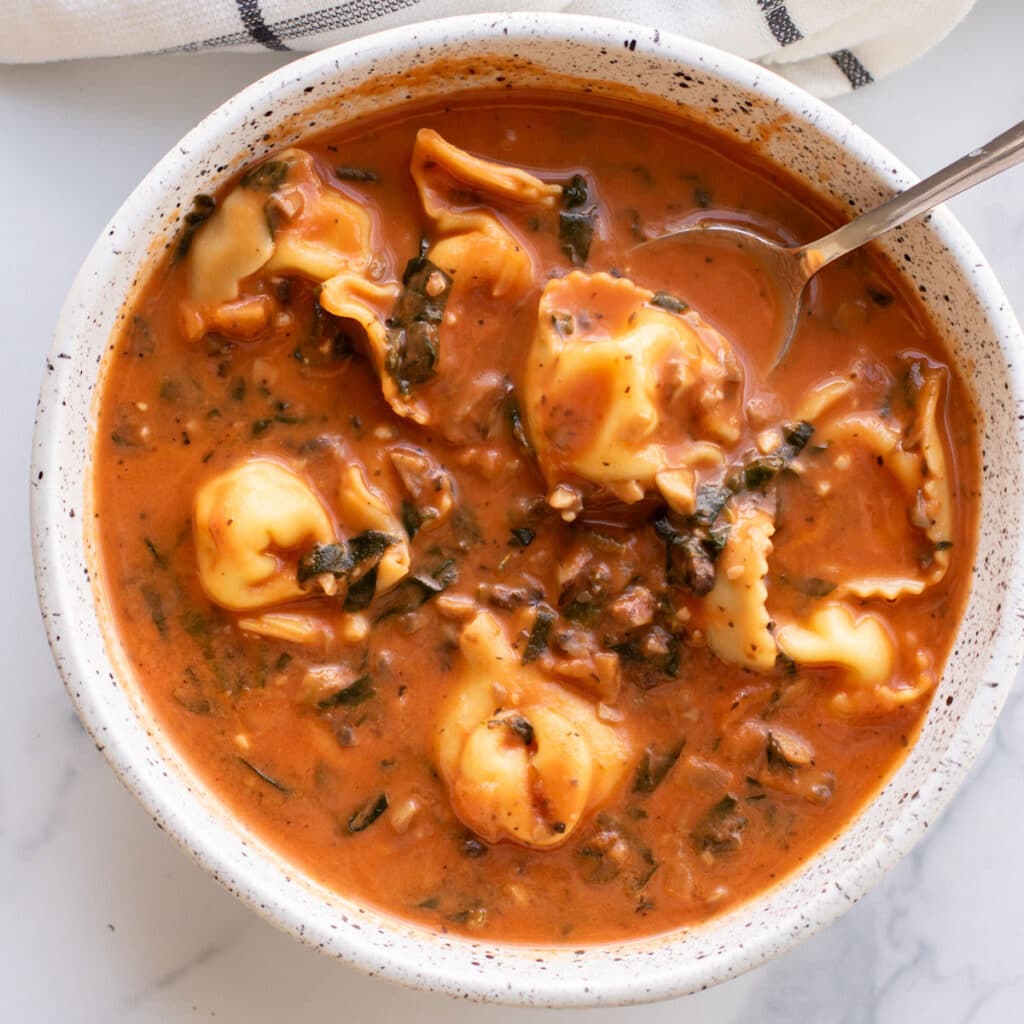 a bowl of tortellini mushroom soup.