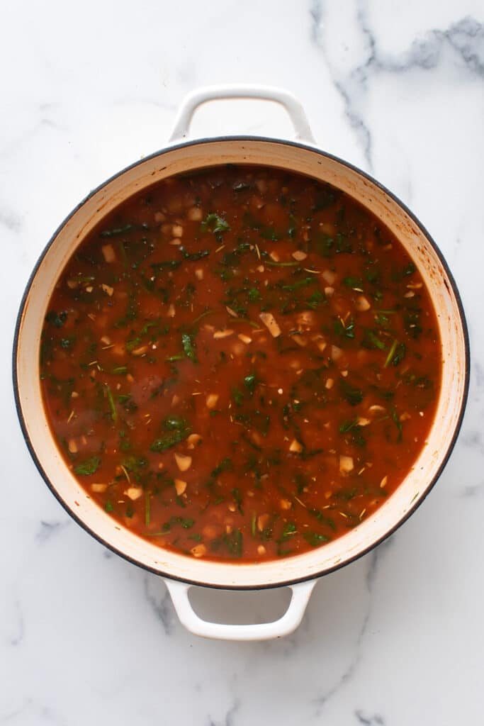 the broth being brought to a simmer.