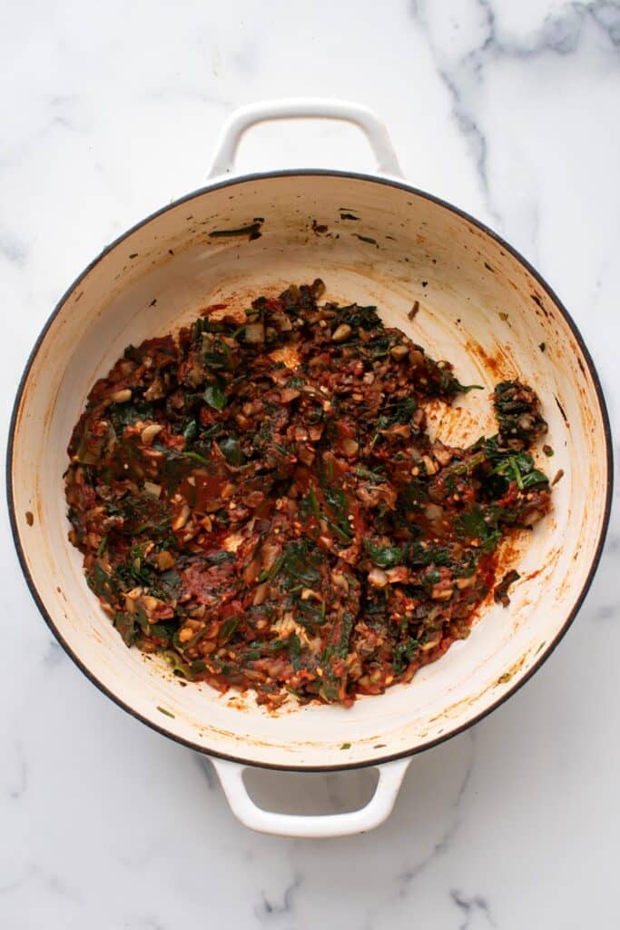 the tomato paste added to the veggies.